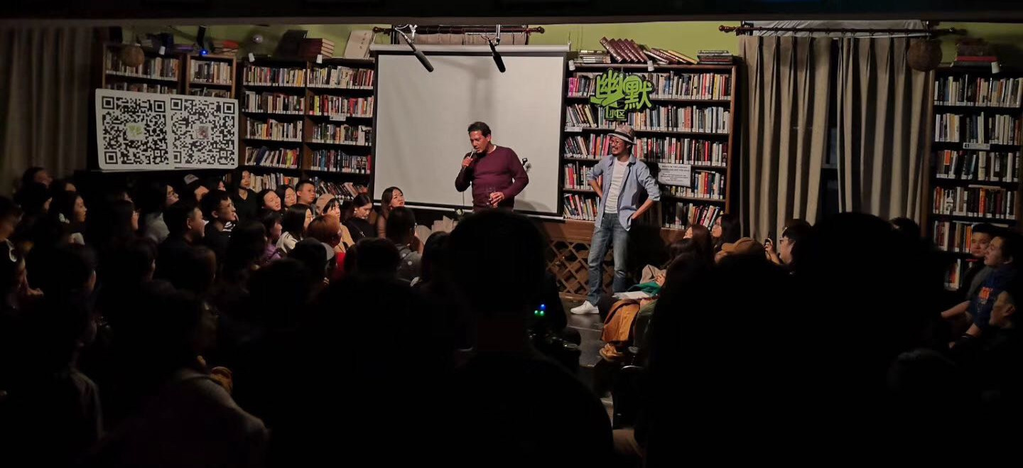 Tony Chou (right) on stage for The Humor Section at the Bookworm, in Beijing, circa 2019. Image provided by Tony Chou.